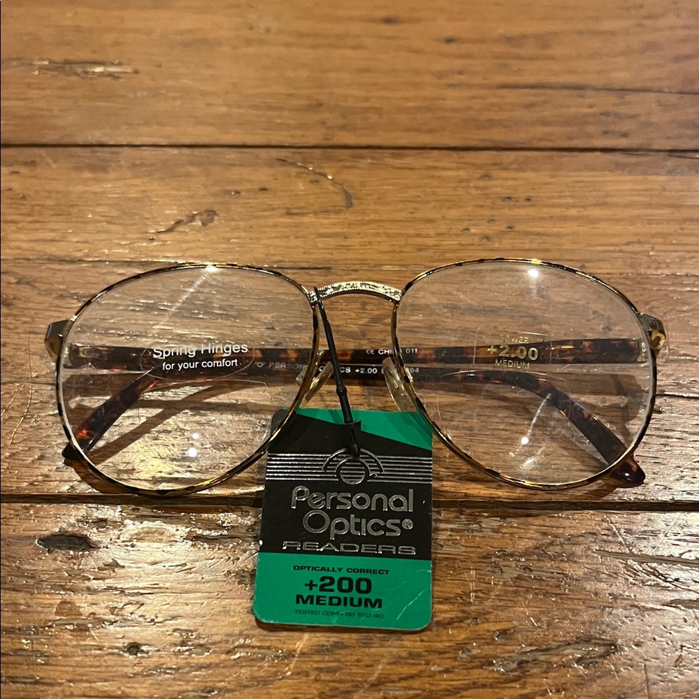 Personal Optics Gold Frame Glasses +200 medium with spring hinges for comfort.